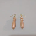 Elegant Gold and Peach Dangle Earrings